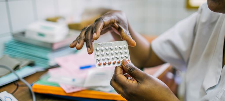 Nurse providing FP/RH services to a patient in Rwanda