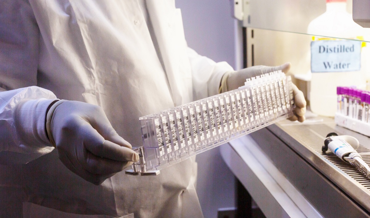 Lab tech handling samples.